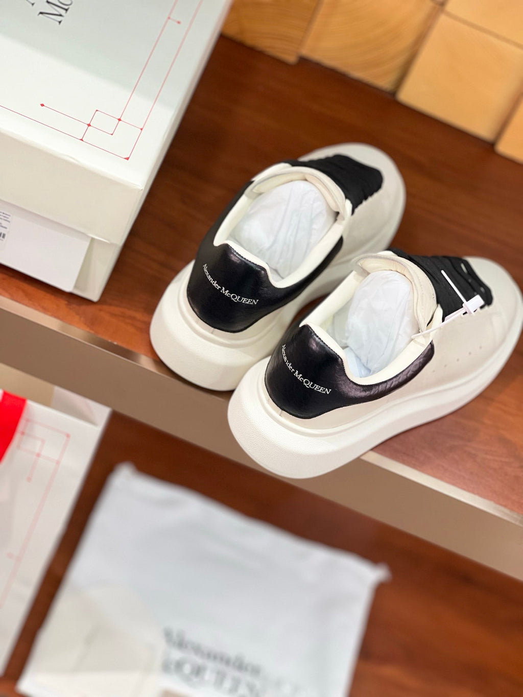 OVERSIZED SNEAKERS IN WHITE CALFSKIN BLACK HEEL BLACK LACES