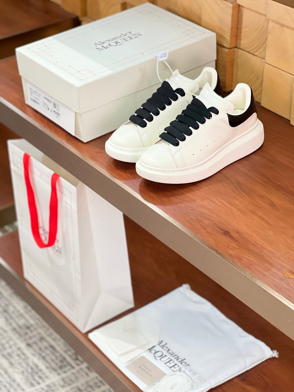 OVERSIZED SNEAKERS IN WHITE CALFSKIN BLACK HEEL BLACK LACES