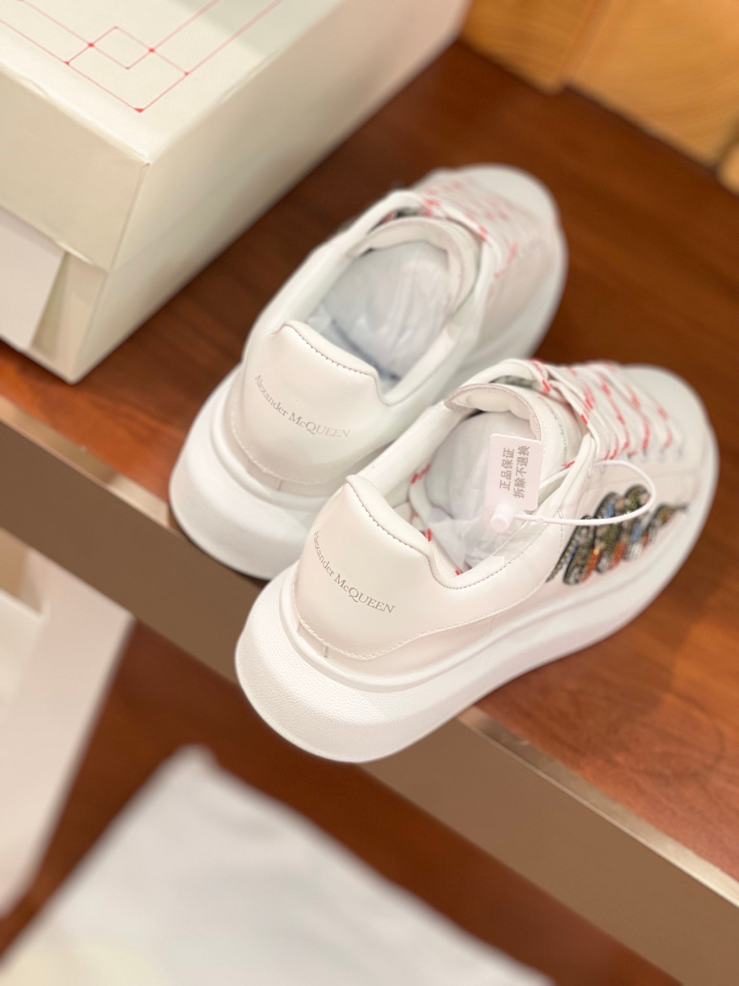 OVERSIZED SNEAKERS IN WHITE CALFSKIN EMBROIDERED CRYSTAL SNAKE