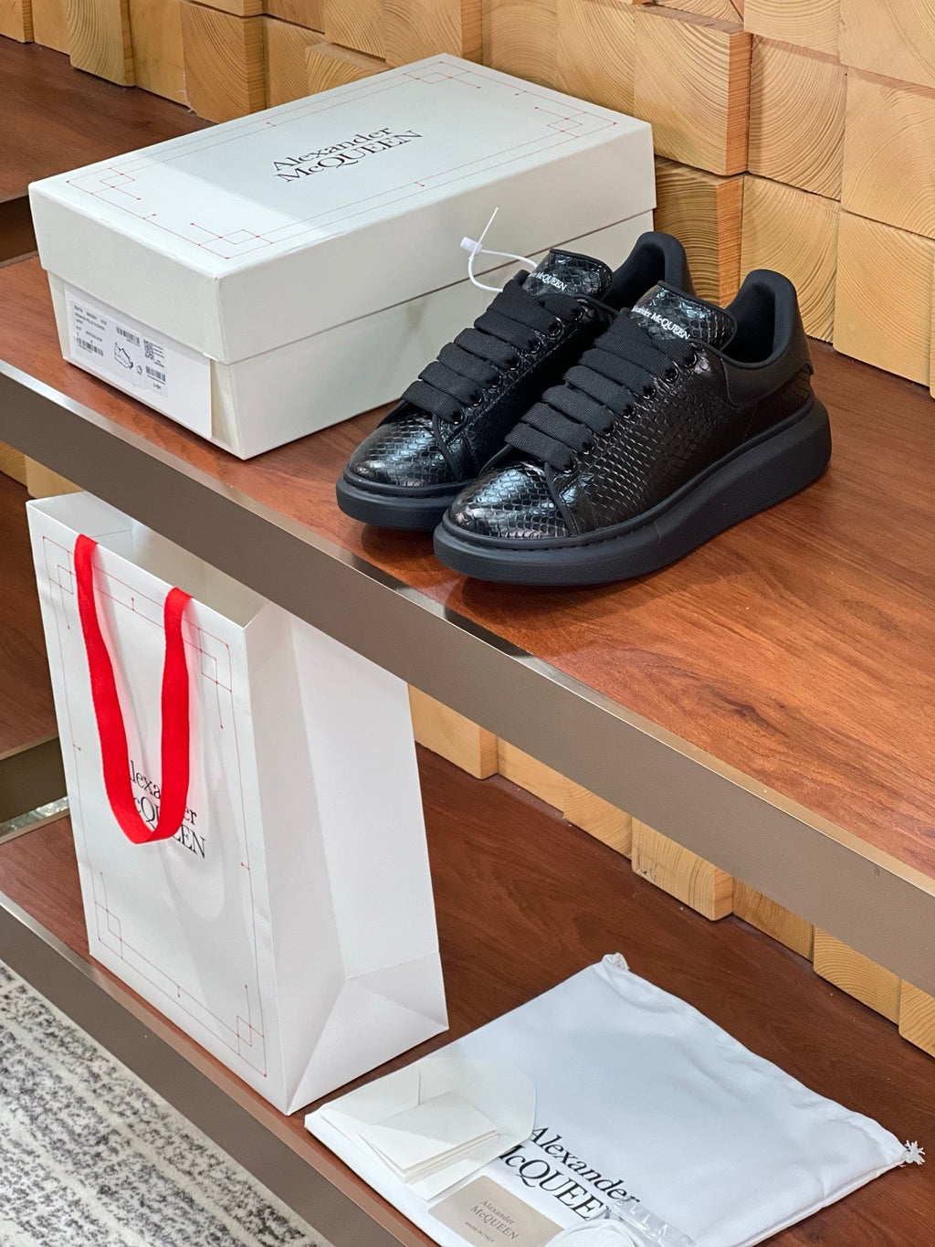 OVERSIZED SNEAKERS IN BLACK GLOSSY CALFSKIN SNAKE-EFFECT