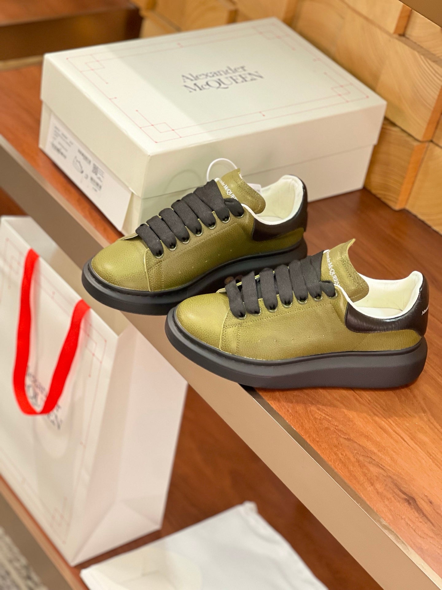 OVERSIZED SNEAKERS IN ARMY GREEN CALFSKIN