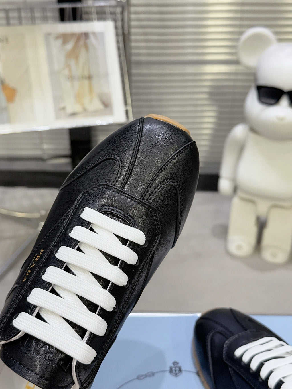 PRADA 26S LACE UP SNEAKERS IN BLACK CALFSKIN