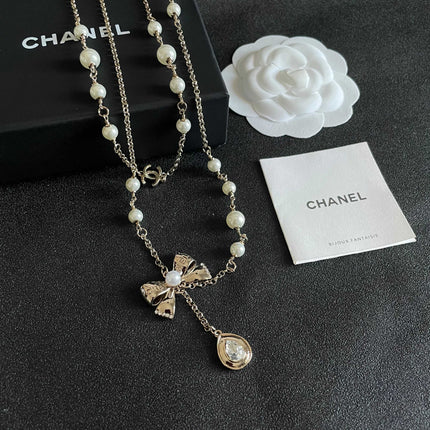 CHANEL 26S DOUBLE C LOGO PEARL LAYERED CHAIN BOW & CRYSTAL DROP NECKLACE IN GOLD METAL 629883