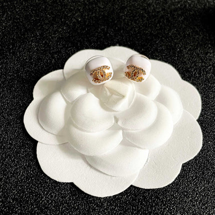 CHANEL 26S CHANEL CC LOGO PAVE CRYSTAL STUD EARRINGS IN WHITE ENAMEL WITH GOLD METAL 633309