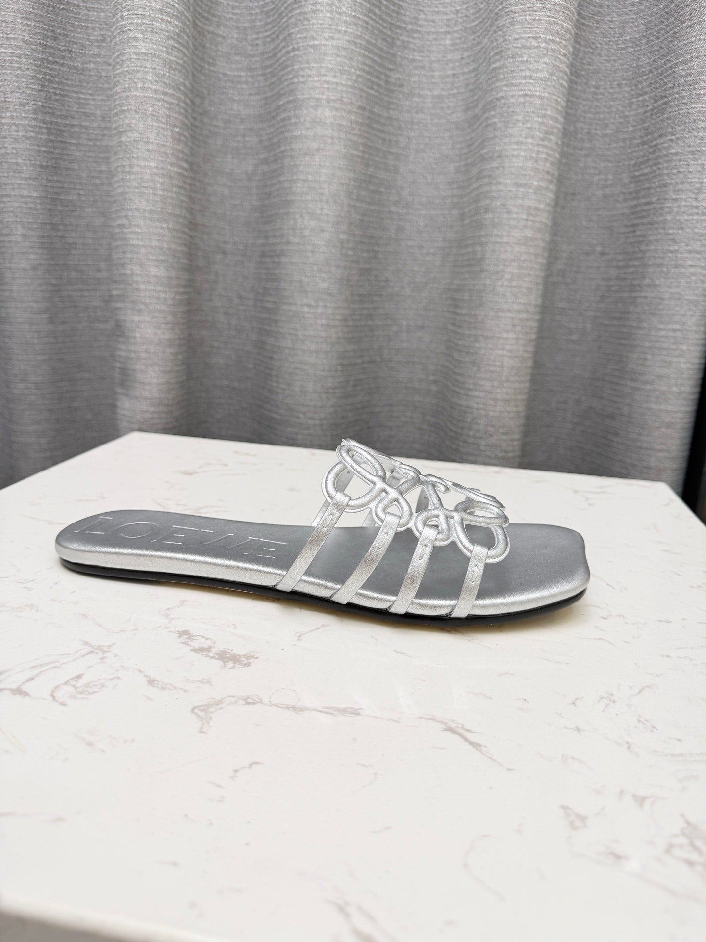 LOEWE 26S PETAL ANAGRAM SLIDE IN SILVER SOFT CALFSKIN