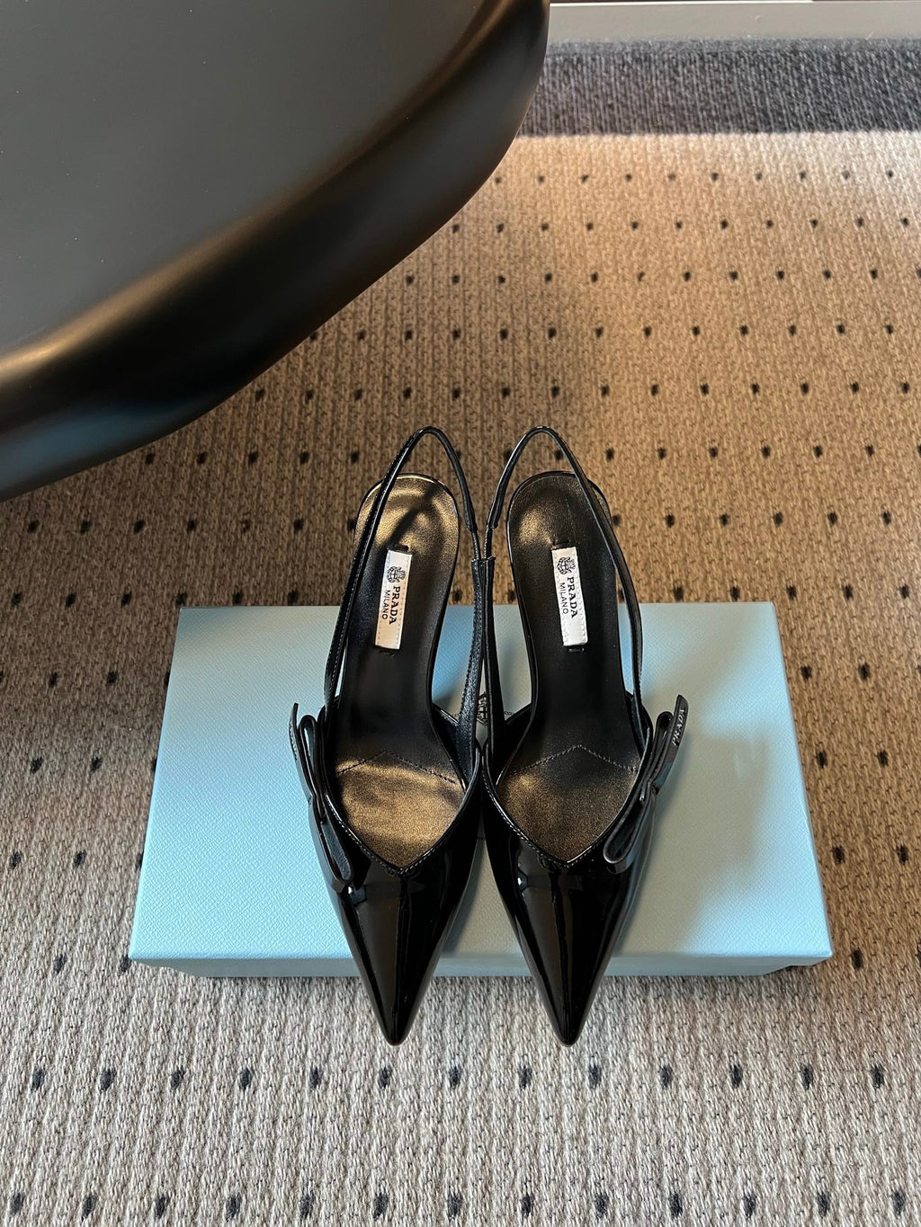 PRADA 26S BOW DETAIL SLINGBACK PUMPS 75MM IN BLACK PATENT CALFSKIN