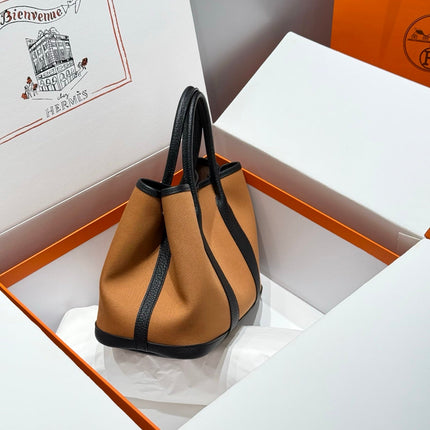 GARDEN PARTY 30CM IN ORANGE MINIMUM TOILETS COTTON CANVAS AND BLACK CALFSKIN