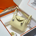 HERMES 25S MINI LINDY 19 IN PASTEL YELLOW CALFSKIN SILVER HARDWARE