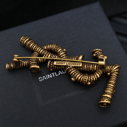 YSL 26S ORNATE TEXTURED MONOGRAM BROOCH IN ANTIQUE GOLD TONE METAL 617587