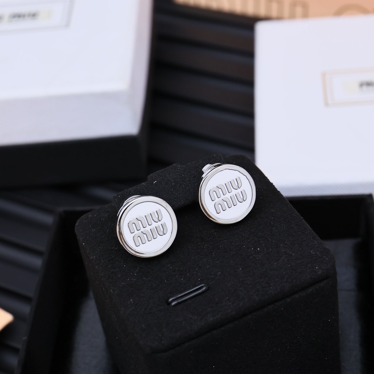 MIUMIU 26S ROUND LOGO STUD EARRINGS IN WHITE ENAMEL AND SILVER TONE METAL 625609