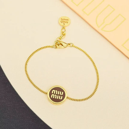 MIUMIU 26S ROUND LOGO CHAIN BRACELET IN GOLD TONE METAL 621549