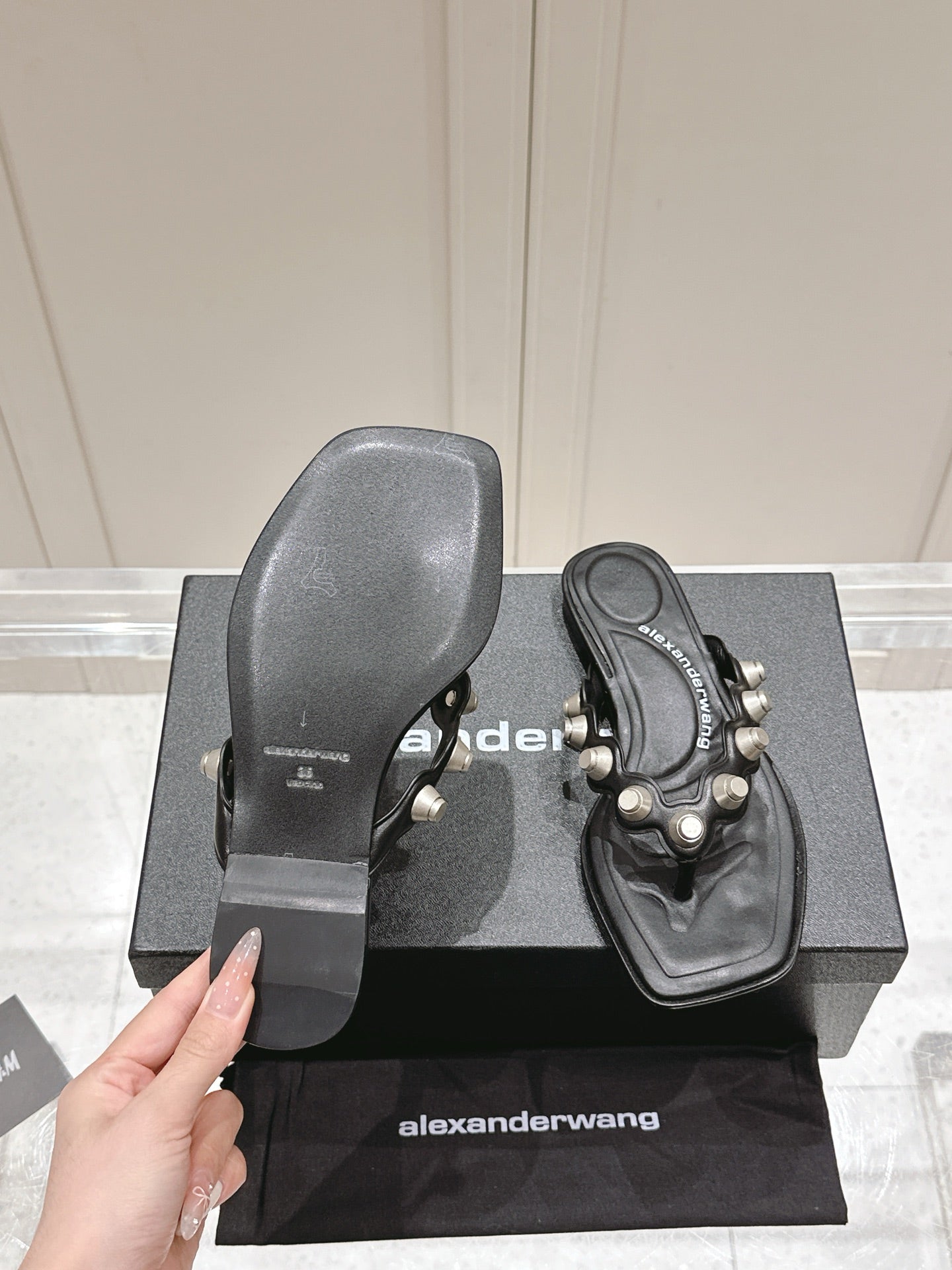 RHODES STUDDED THONG SANDALS IN BLACK CALFSKIN