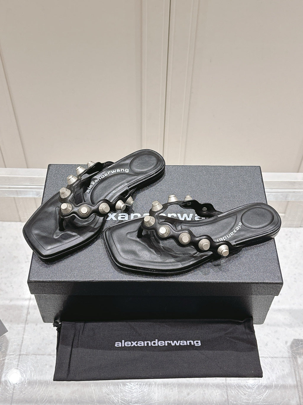 RHODES STUDDED THONG SANDALS IN BLACK CALFSKIN