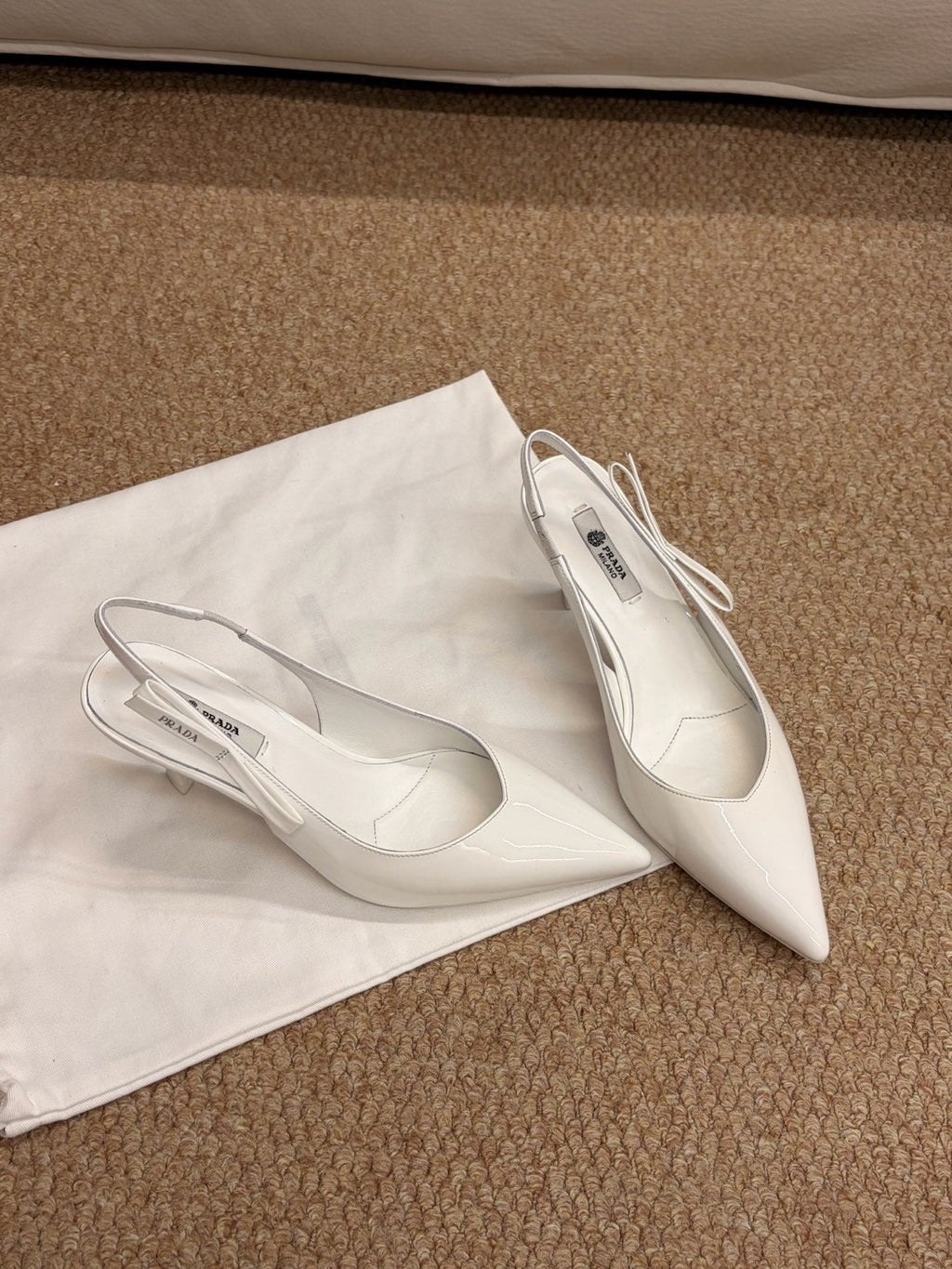 PRADA 26S SLINGBACK PUMPS IN WHITE PATENT CALFSKIN