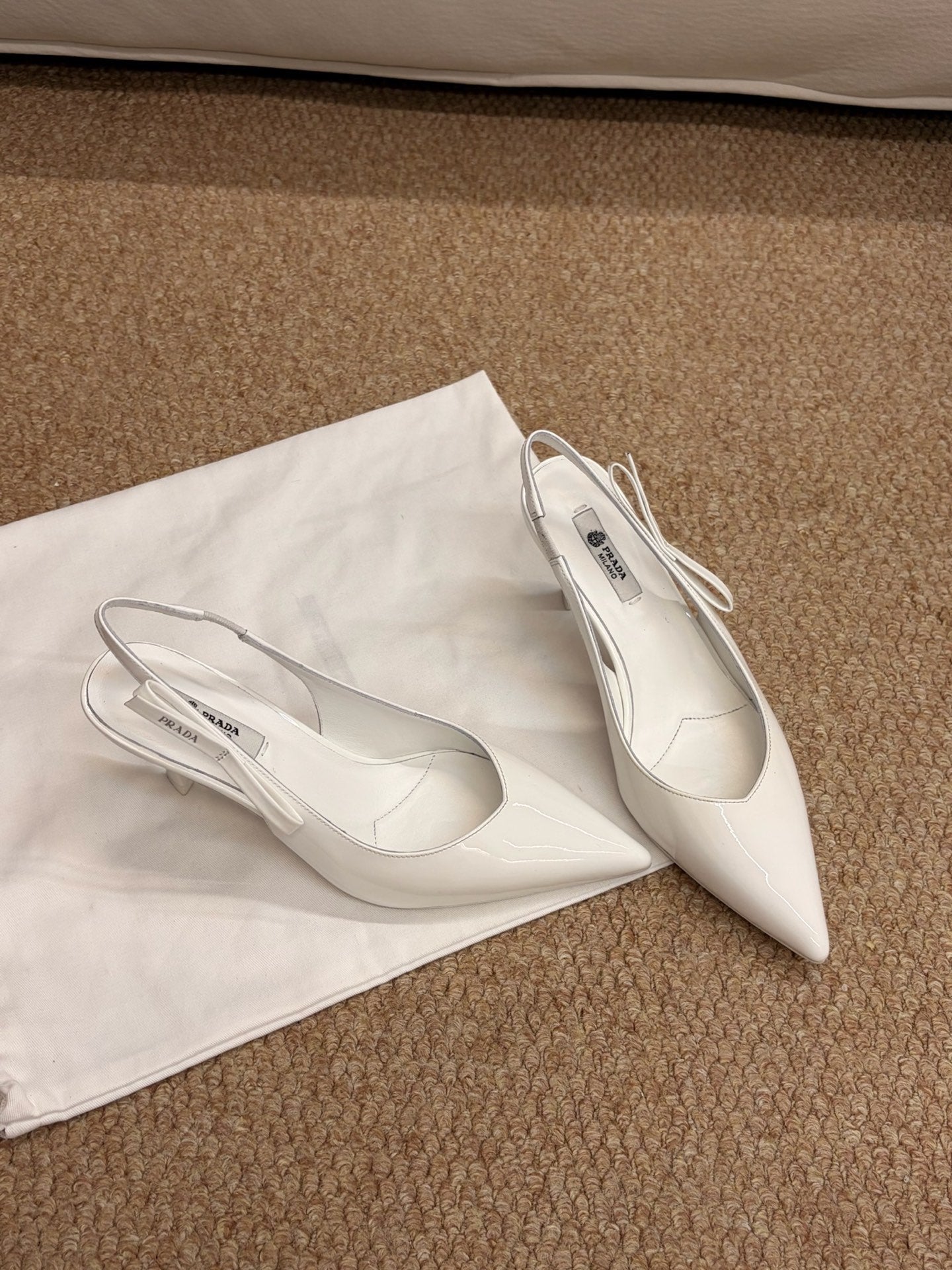 PRADA 26S SLINGBACK PUMPS IN WHITE PATENT CALFSKIN