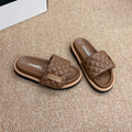 CHANEL 26S SLIDE SANDALS IN BROWN QUILTED CALFSKIN WITH LOGO PLAQUE