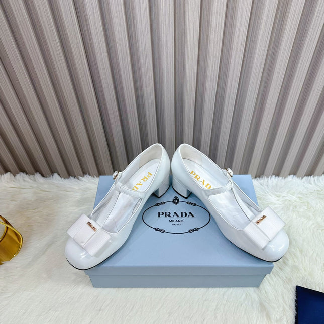 PRADA 26S T-STRAP MARY JANE PUMPS 40MM IN LIGHT BLUE PATENT CALFSKIN WITH BOW