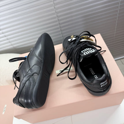 MIUMIU 26S GYMNASIUM SNEAKER IN BLACK CALFSKIN WITH GOLD BUCKLED STRAP