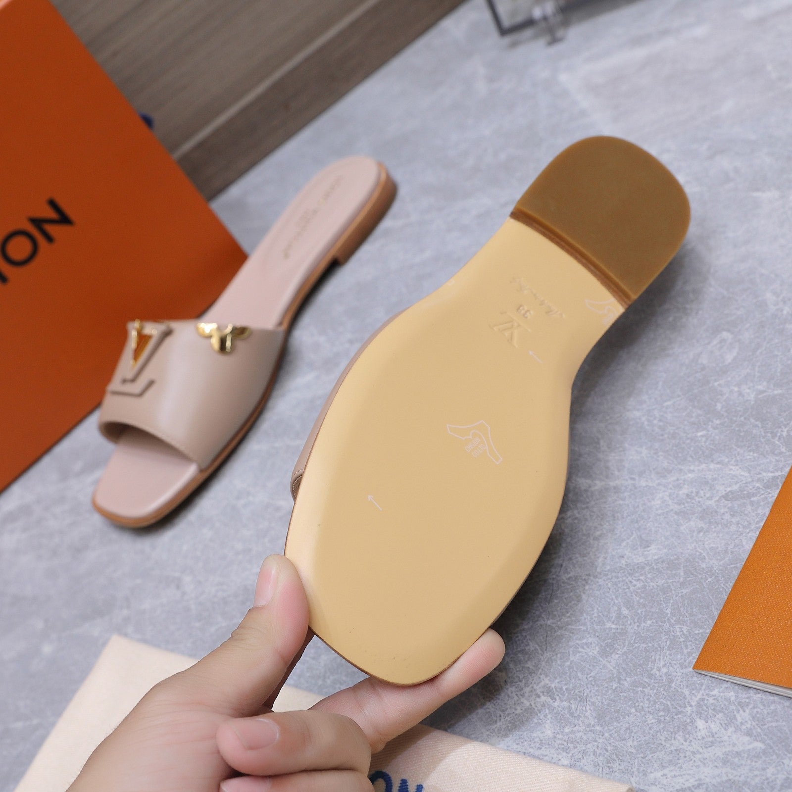 LV 26S FLAT SLIDE SANDALS IN NUDE PINK CALFSKIN GOLD HARDWARE