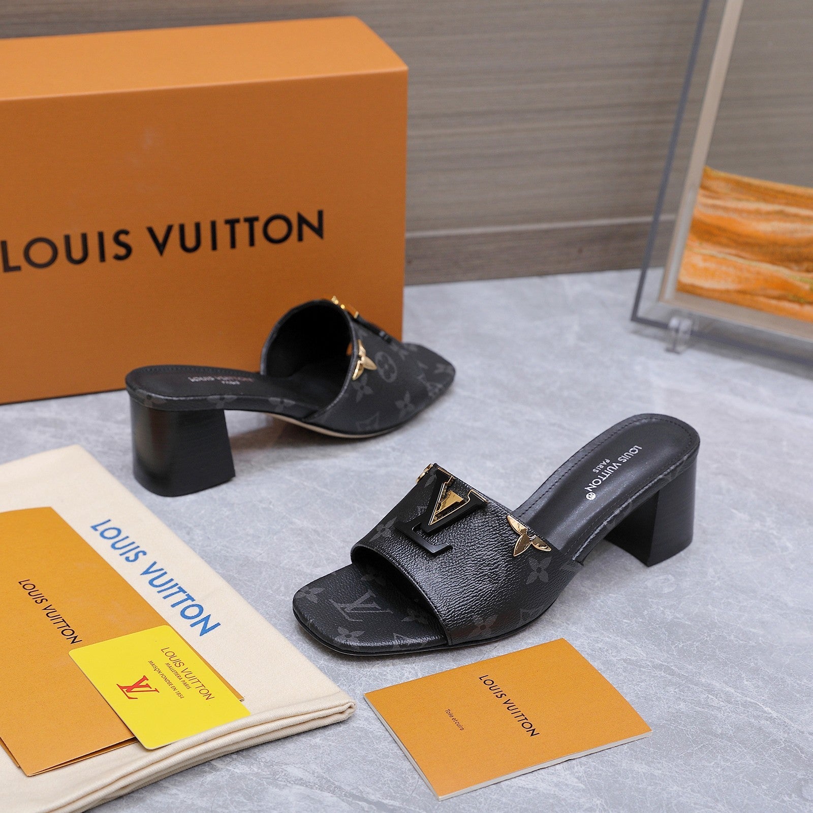 LV 26S BLOCK HEEL MULE SANDALS 55MM IN BLACK MONOGRAM CALFSKIN GOLD HARDWARE