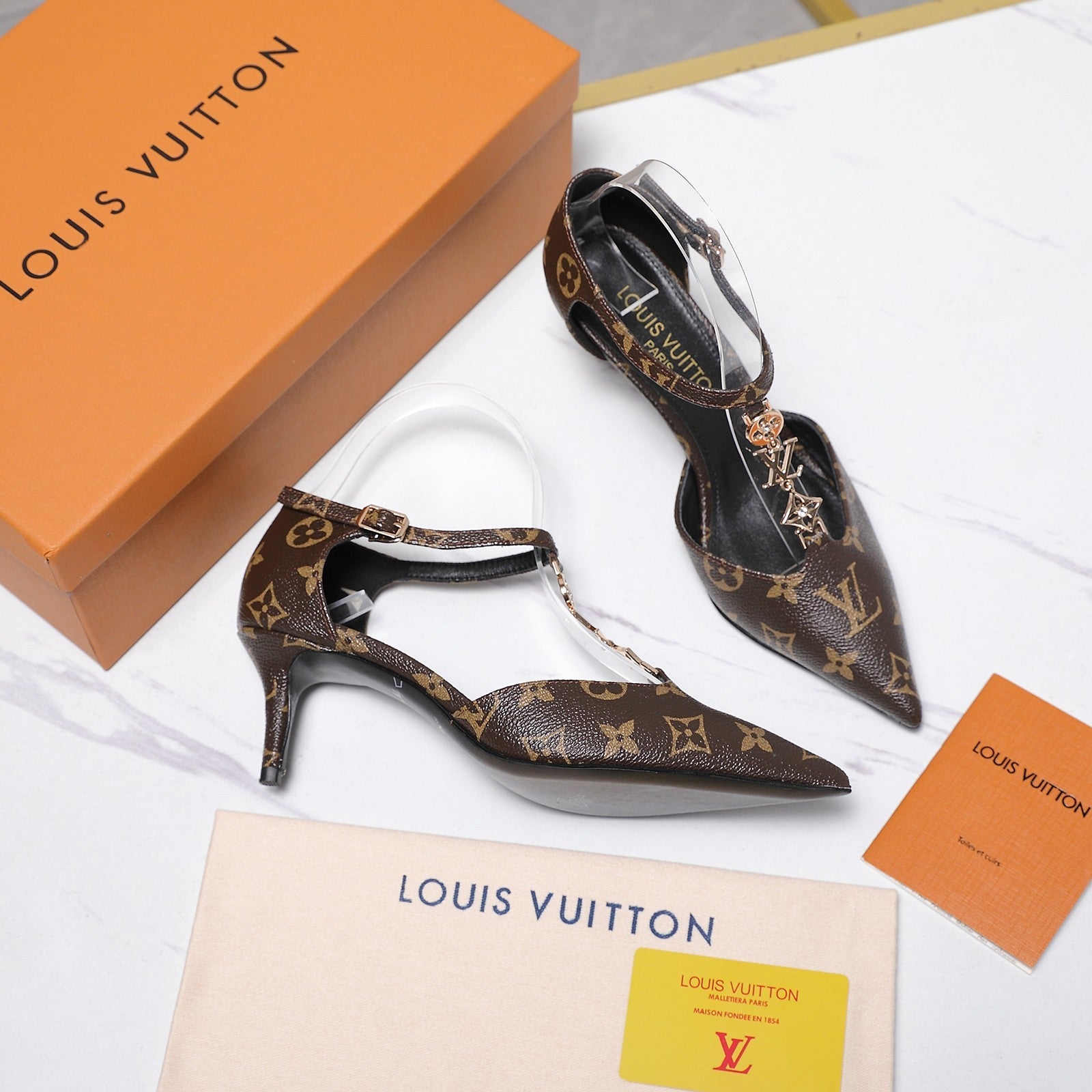 LV 26S ELEGANT T-STRAP HEELS 65MM IN DARK BROWN MONOGRAM CALFSKIN GOLD HARDWARE