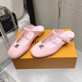 LV 26S FLAT MULES IN PINK PATENT CALFSKIN