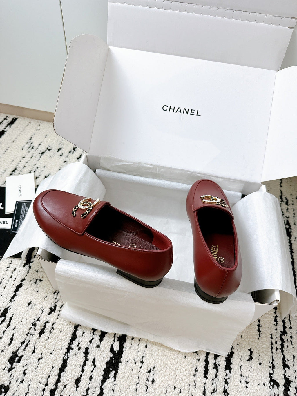 LOAFERS IN RED CALFSKIN HARDWARE WITH ROCK MIX CHAIN
