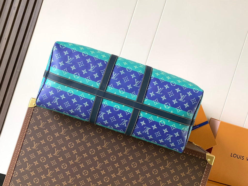 LV 26S KEEPALL 50 IN BLUE WITH LIGHT BLUE ACCENTS COATED CANVAS