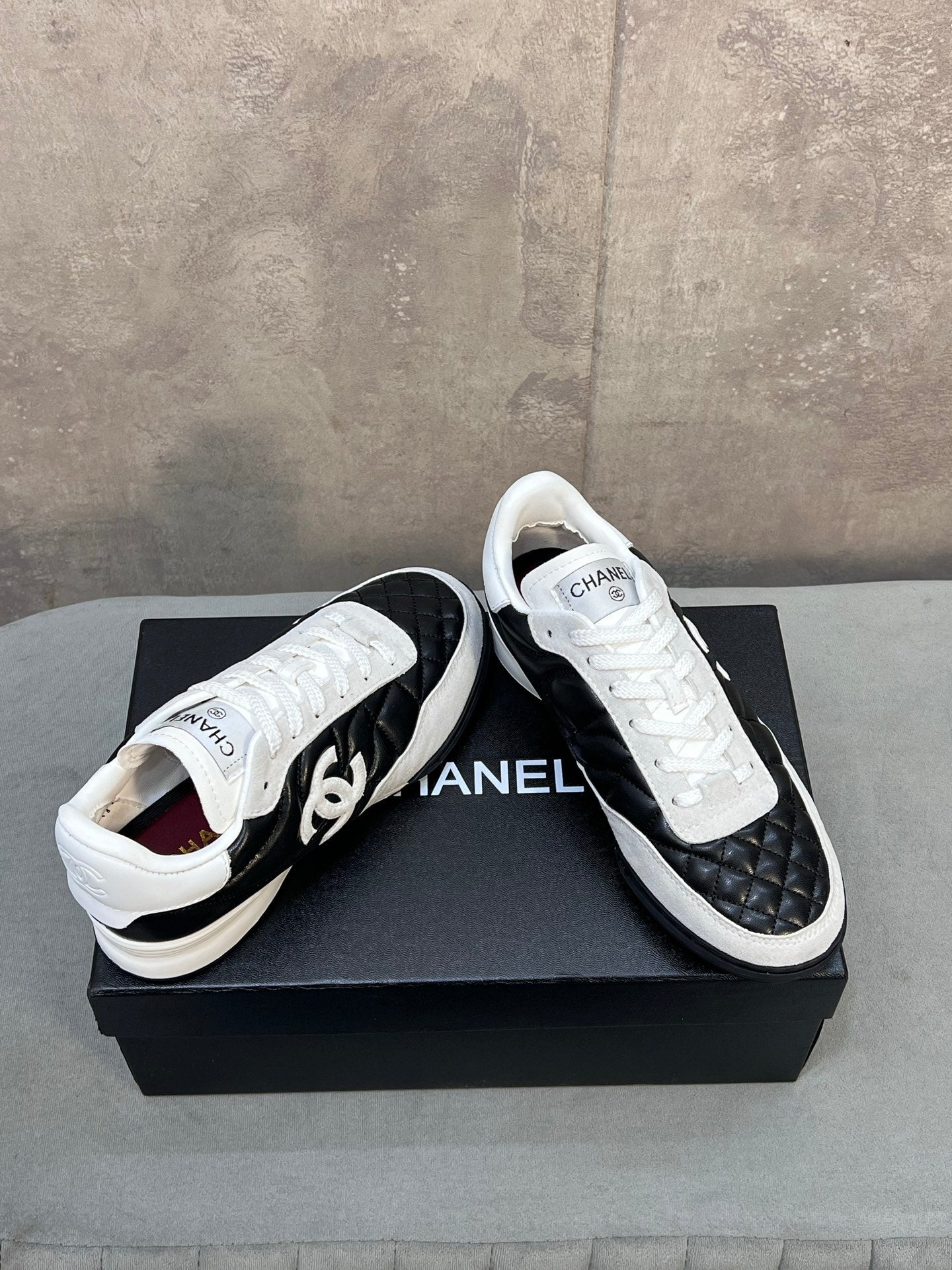 CHANEL 26S SNEAKERS IN BLACK AND WHITE QUILTED CALFSKIN CC LOGO