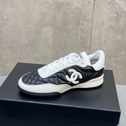 CHANEL 26S SNEAKERS IN BLACK AND WHITE QUILTED CALFSKIN CC LOGO