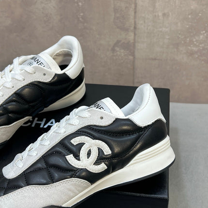 CHANEL 26S SNEAKERS IN BLACK AND WHITE QUILTED CALFSKIN CC LOGO
