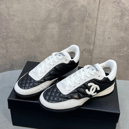 CHANEL 26S SNEAKERS IN BLACK AND WHITE QUILTED CALFSKIN CC LOGO