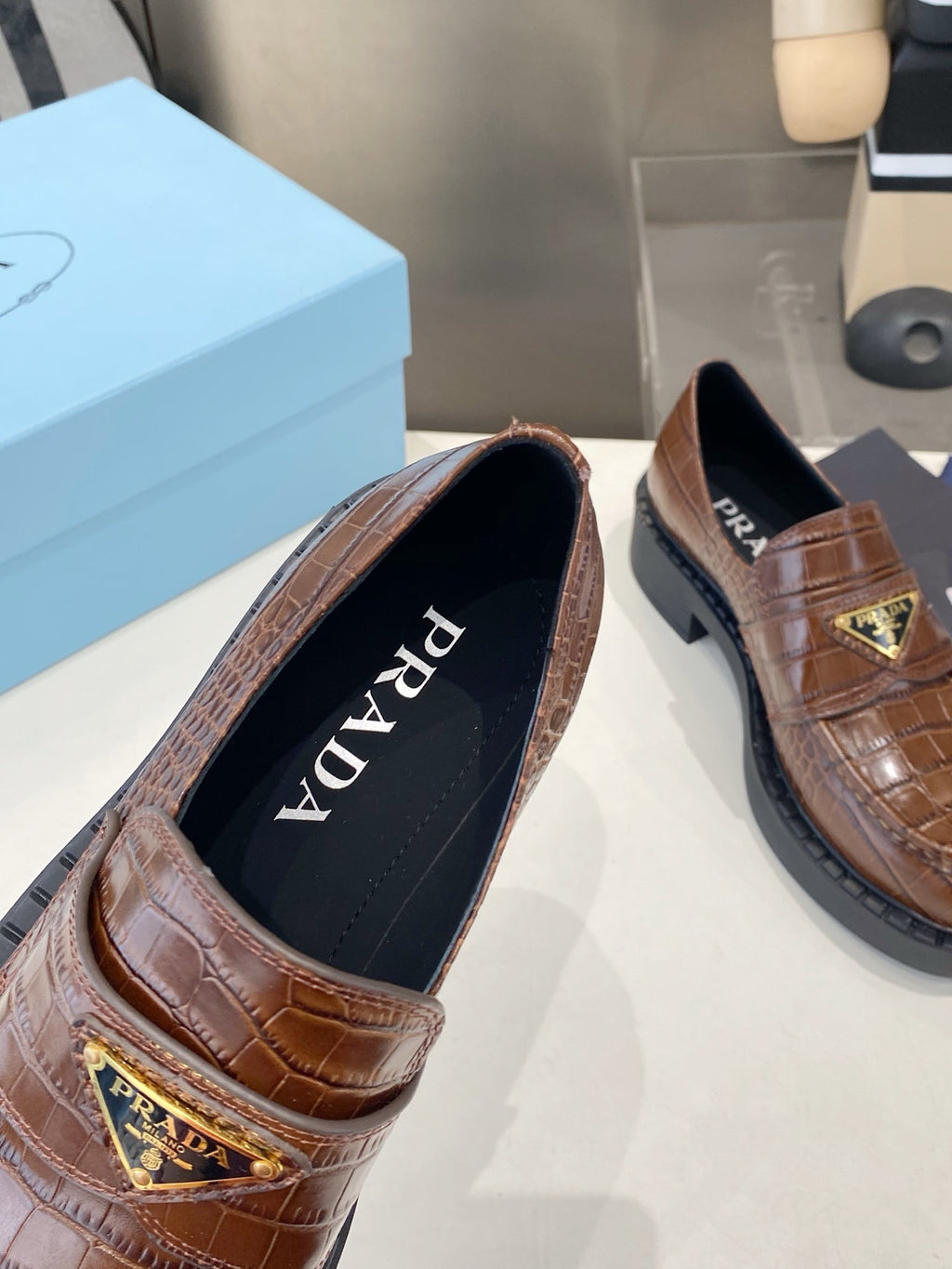 PRADA 26S LOAFERS IN DARK BROWN CROCODILE PRINT CALFSKIN