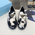 PRADA 26S LOAFERS IN WHITE AND BLACK COW PRINT PONY HAIR