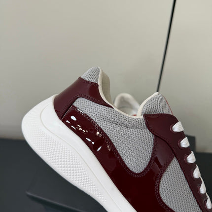 PRADA 26S SNEAKERS IN BURGUNDY RED PATENT CALFSKIN AND WHITE MESH