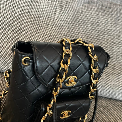 CHANEL 26S BACKPACK WITH FRONT POCKET 21 IN BLACK QUILTED LAMBSKIN GOLD HARDWARE