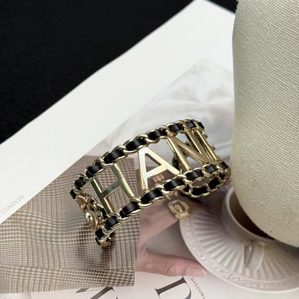 CHANEL 26S CHANEL LOGO OPEN CUFF LEATHER CHAIN BRACELET IN GOLD METAL 630836