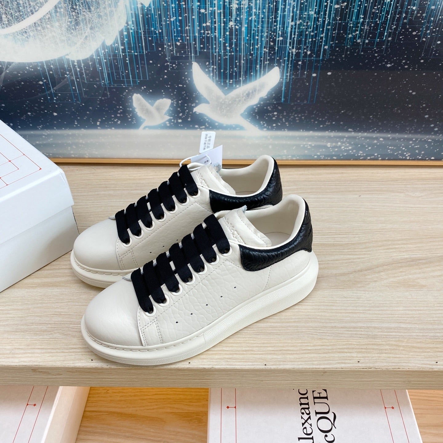 OVERSIZED SNEAKERS IN WHITE TEXTURED CALFSKIN BLACK HEEL BLACK LACES