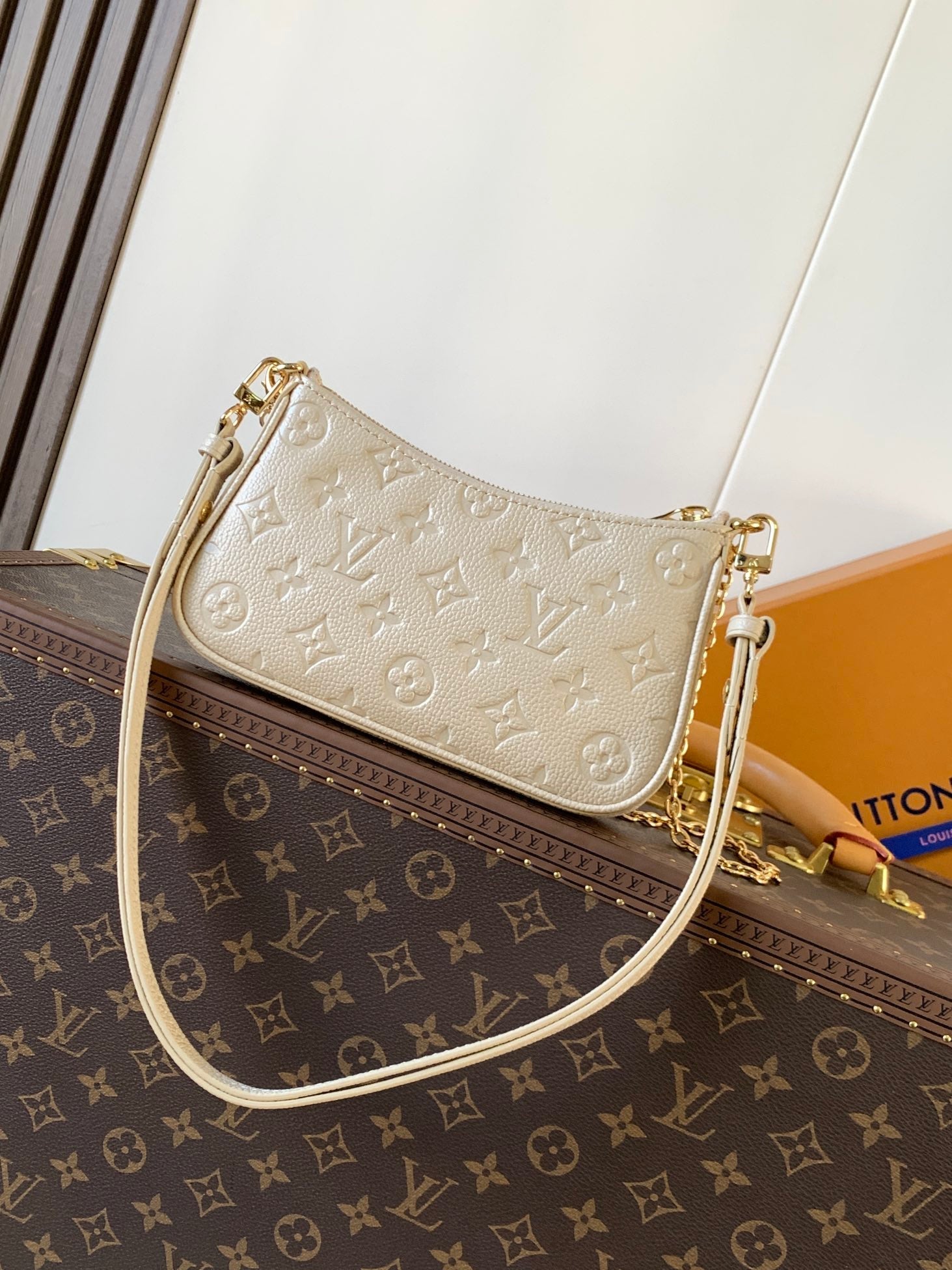 EASY POUCH ON STRAP 19 IN BEIGE MONOGRAM EMPREINTE LEATHER