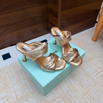 AQUAZZURA 26S TWISTED HEEL SANDALS 85 MM IN SOFT GOLD LAMBSKIN