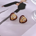 YSL 26S HEART CRYSTAL LOGO STUD EARRINGS IN RED ENAMEL AND GOLD TONE METAL 629854