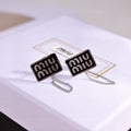 MIUMIU 26S RECTANGULAR LOGO CHAIN STUD EARRINGS IN BLACK ENAMEL AND SILVER TONE METAL 629947
