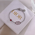 CD 26S PAVE LOGO RED CRYSTAL BRACELET IN SILVER TONE METAL 631790