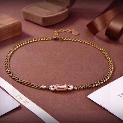 CD 26S DIOR LOGO PINK CRYSTAL CHAIN NECKLACE IN AGED GOLD METAL 633118