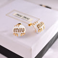 MIUMIU 26S MIU CRYSTAL LOGO STUD EARRINGS IN WHITE ENAMEL AND GOLD TONE METAL 633129