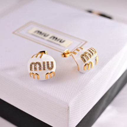 MIUMIU 26S MIU CRYSTAL LOGO STUD EARRINGS IN WHITE ENAMEL AND GOLD TONE METAL 633129