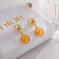 CD 26S DOUBLE PEARL MEDALLION LOGO DROP EARRINGS IN GOLD METAL