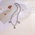 GUCCI 26S INTERLOCKING G LOGO STAR HEART MULTI CHARM CHAIN BRACELET IN SILVER TONE METAL