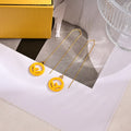 FENDI 26S FF LOGO THREADER EARRINGS IN YELLOW RESIN AND GOLD TONE METAL 634941