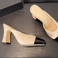 MULES IN BLACK AND BEIGE SUEDE